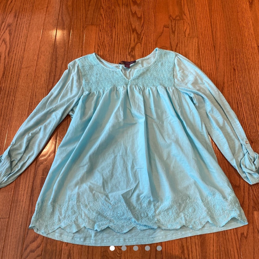 light blue shirt with roll up sleeves